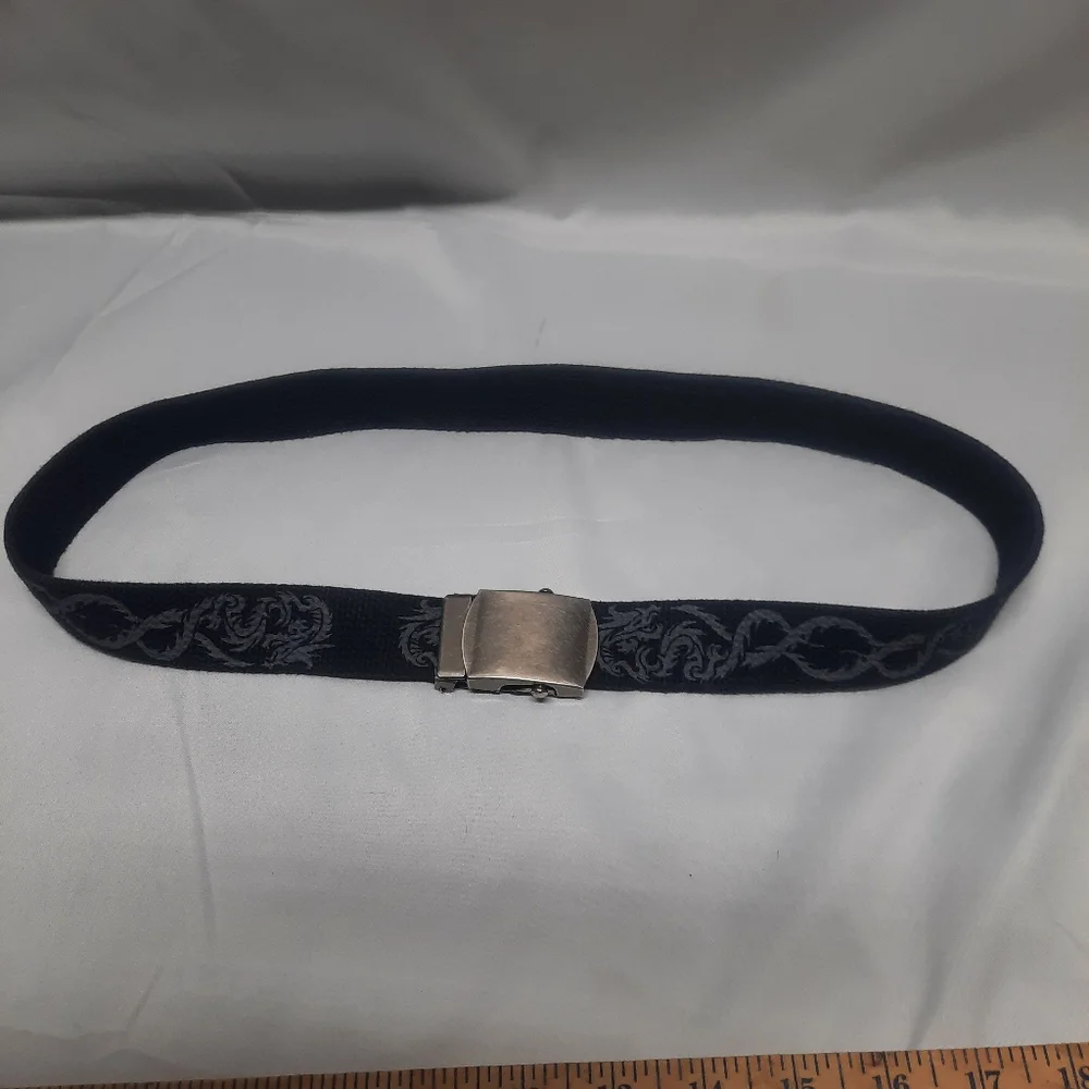 Reversible black belt, side 1 is black w/ grey dragons & side 2 is solid Black